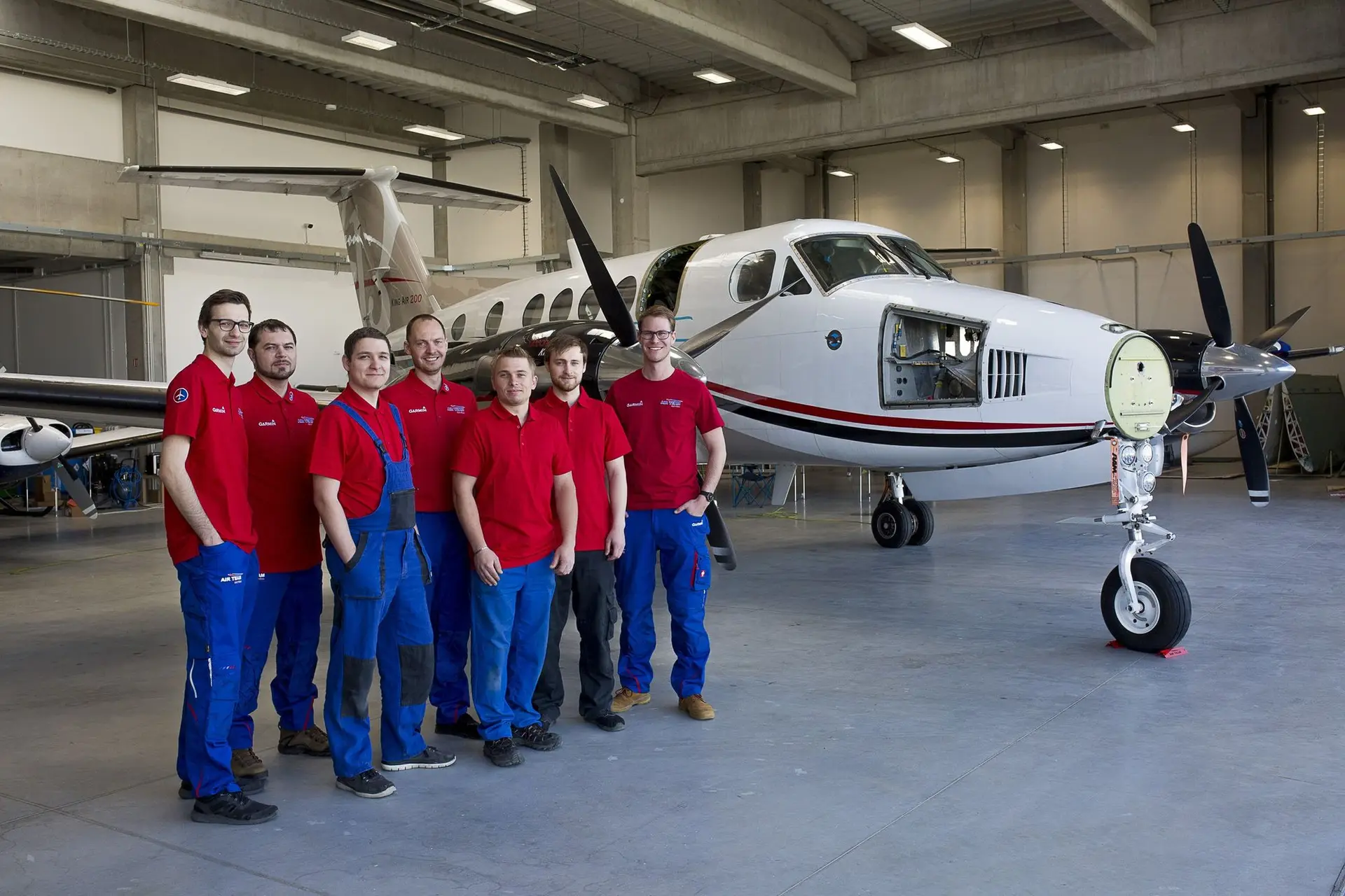 The AIR TEAM hangar team in front of a King Air 200 at Kunovice