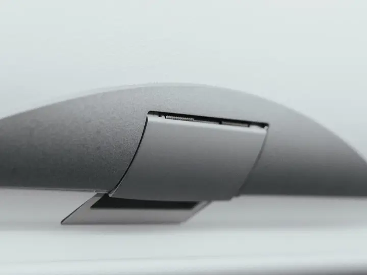 Grey cover with a hinged flap and bracket