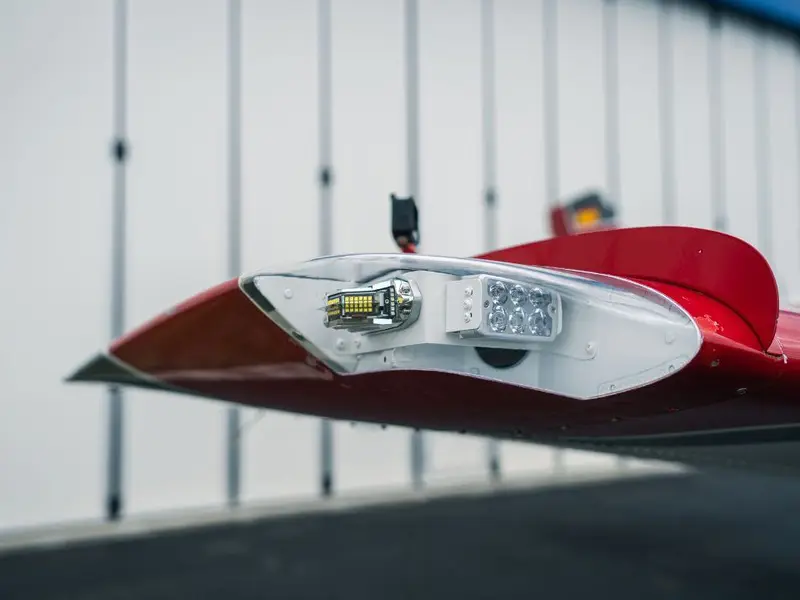Red wingtip with a light assembly exposed