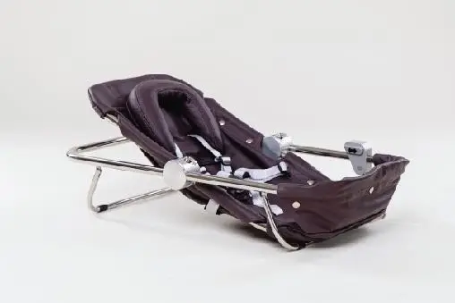 Baby cradle with a metal frame and a fabric seat