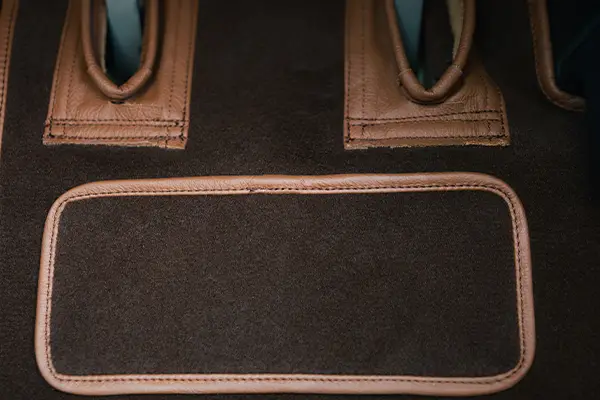 Aviation carpet with leather binding