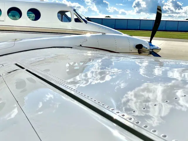 Water beading on the coated wing of a business aircraft