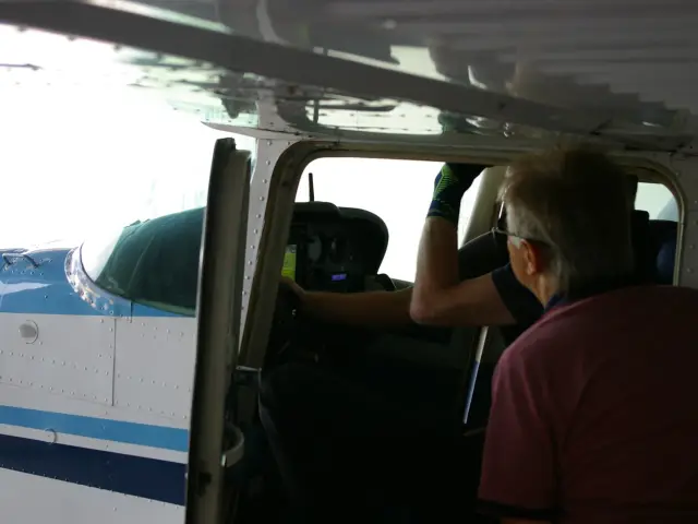 Pilot checking the new panel