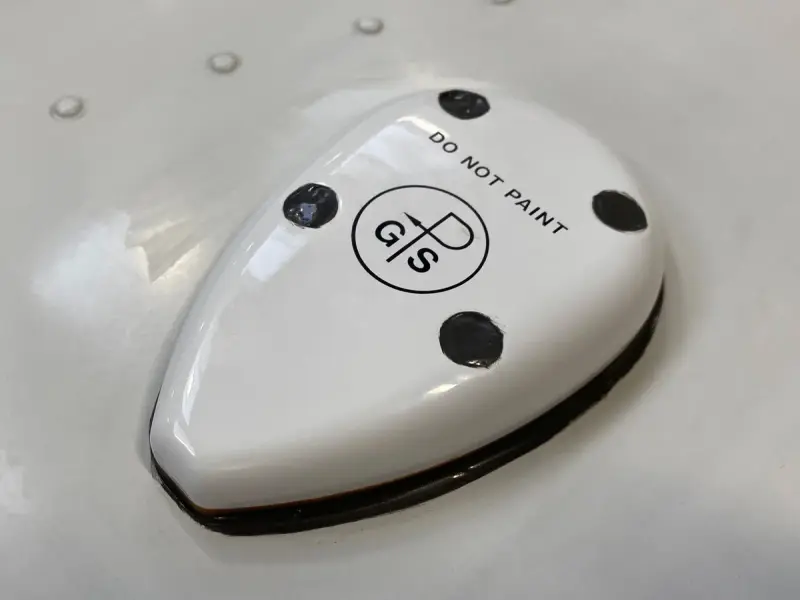 White GPS antenna dome marked do not paint on an aircraft skin