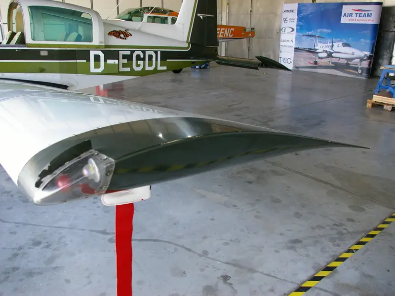 Wing with registration marks and a stripe
