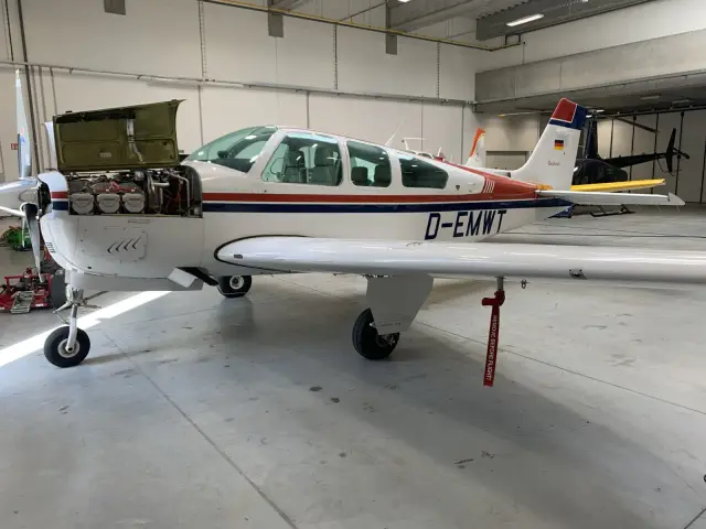 Beechcraft F33A Bonanza in the hangar with the cowling open