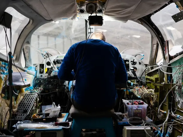 Technician working on the instrument panel from inside the cabin
