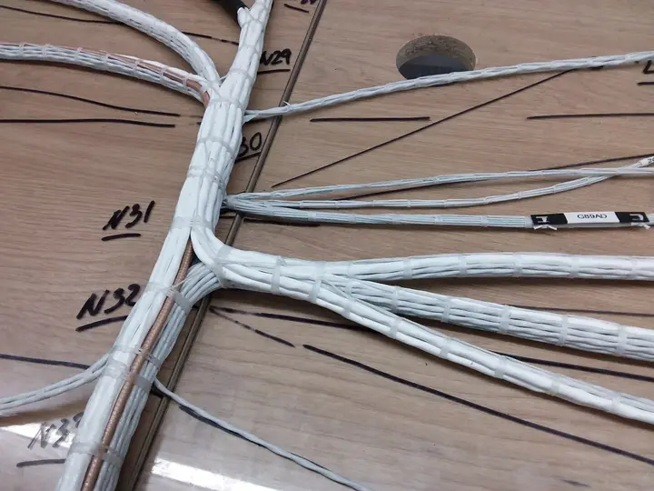 Wiring harness branching into several runs on a form board