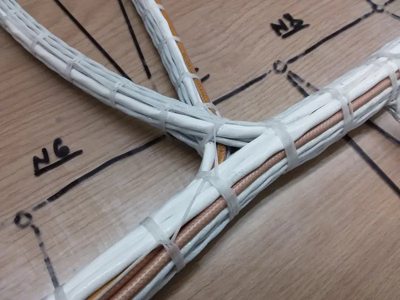 Wiring harness laid out on a labelled formboard
