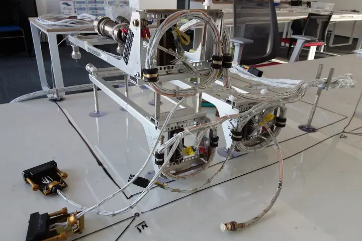 Wiring harness on a test fixture on the lab floor