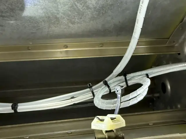 Wire harness routed through the fuselage