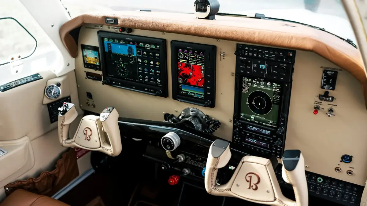 Beechcraft F33A Bonanza cockpit with Garmin G3X displays, GTN 750Xi and a tan and leather interior