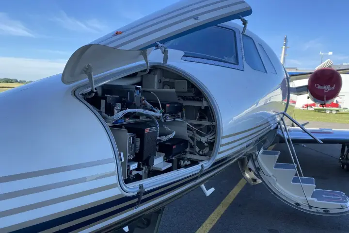 Cessna Citation Excel on the ramp with the nose avionics bay open