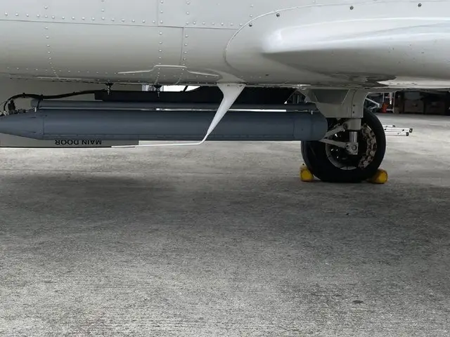 SAR radar pod mounted under the fuselage of the special-mission aircraft on the ramp