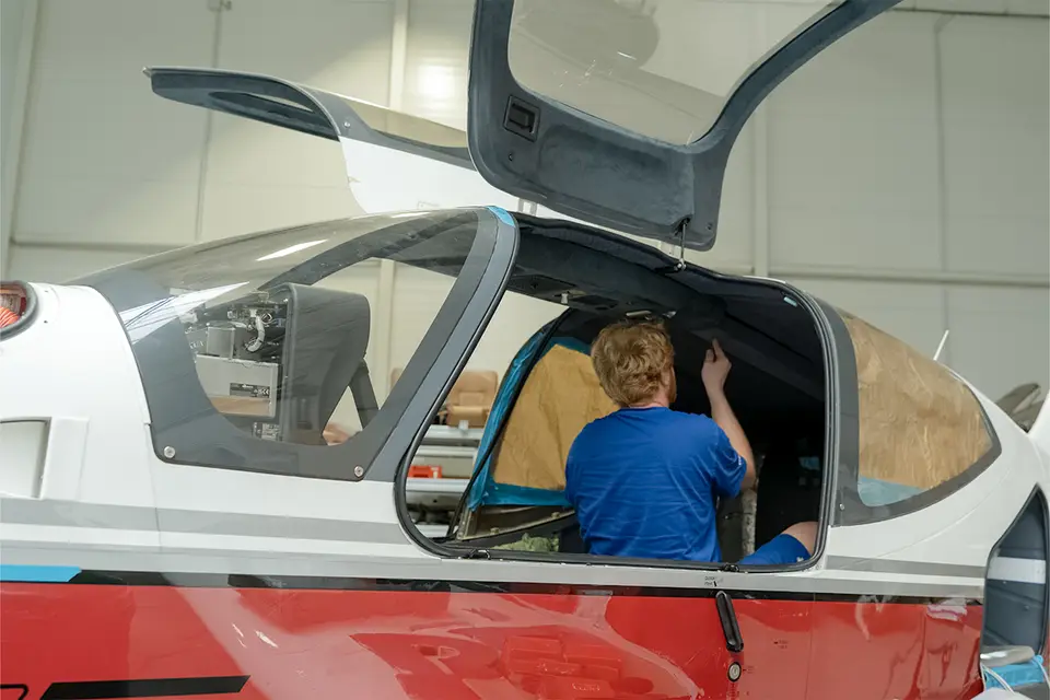AIR TEAM aircraft mechanic at work in the hangar