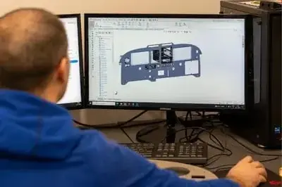 Design engineer working on an aircraft model in CAD
