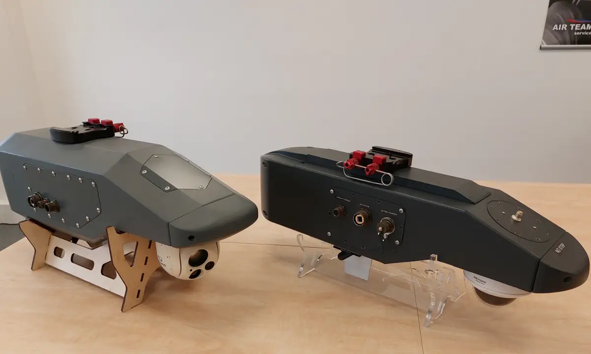 Two dark sensor pod housings on stands