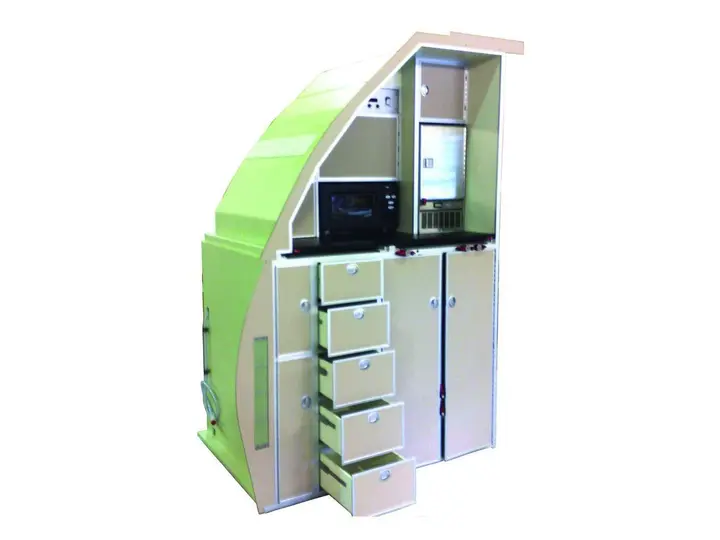 Galley monument with drawers, compartments and a trolley bay