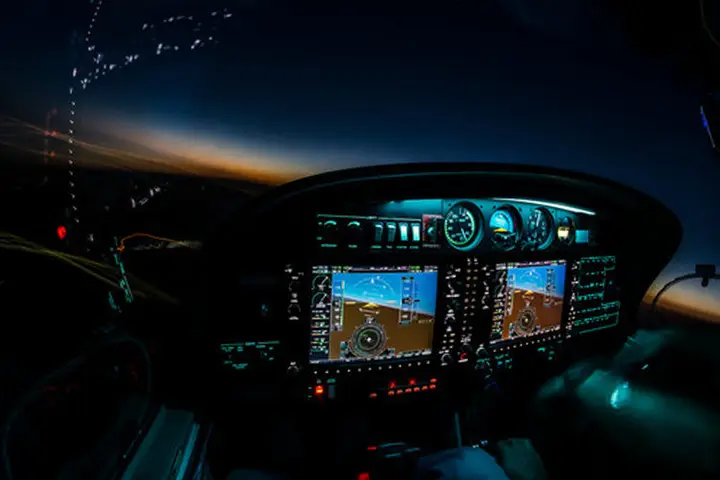 Cockpit at night with an illuminated panel