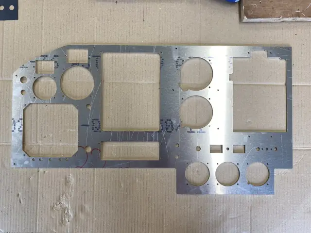Machined aluminium panel with cut-outs for the new units