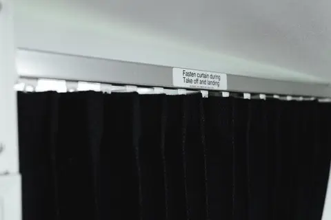 Black cabin curtain with a placard