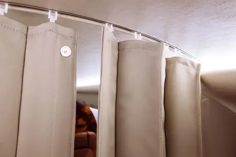 Cabin curtains on a curved rail