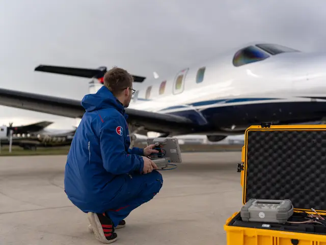 Technician at the nose of a business jet on the ramp
