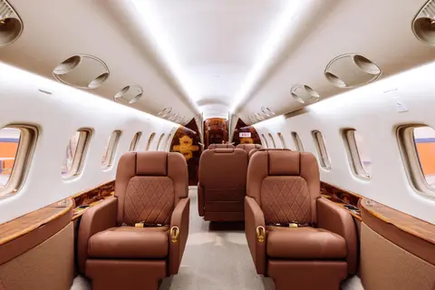 Leather club seats in a business jet cabin
