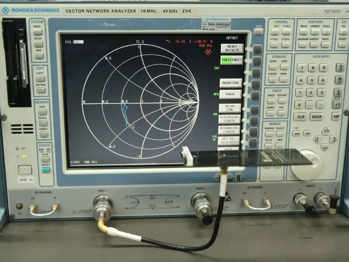 Network analyser showing a Smith chart on its display