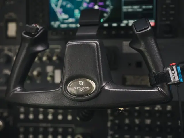 Pilot yoke in front of the Garmin display